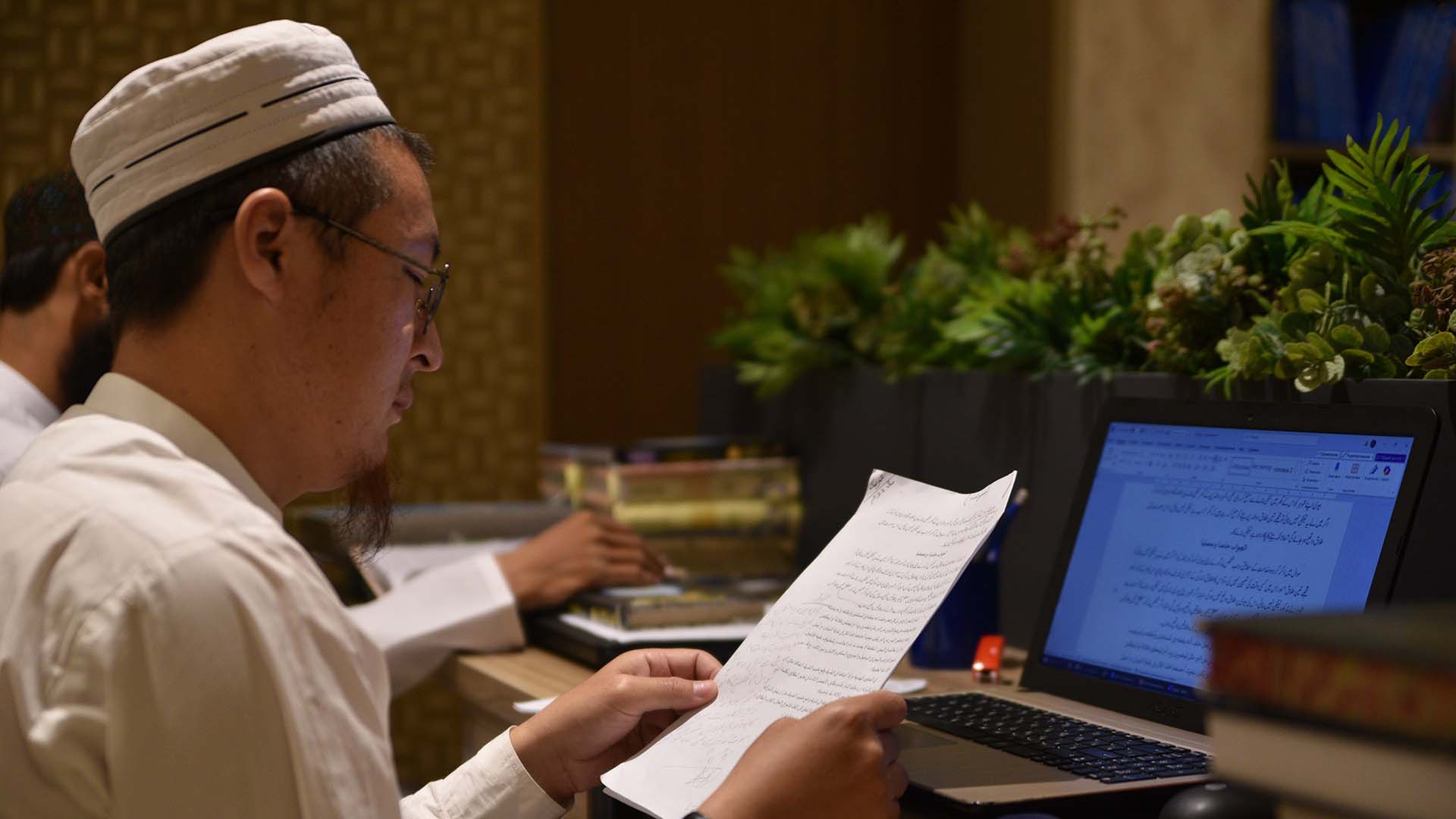 Students researching fiqh issues at Binoria Darul Ifta